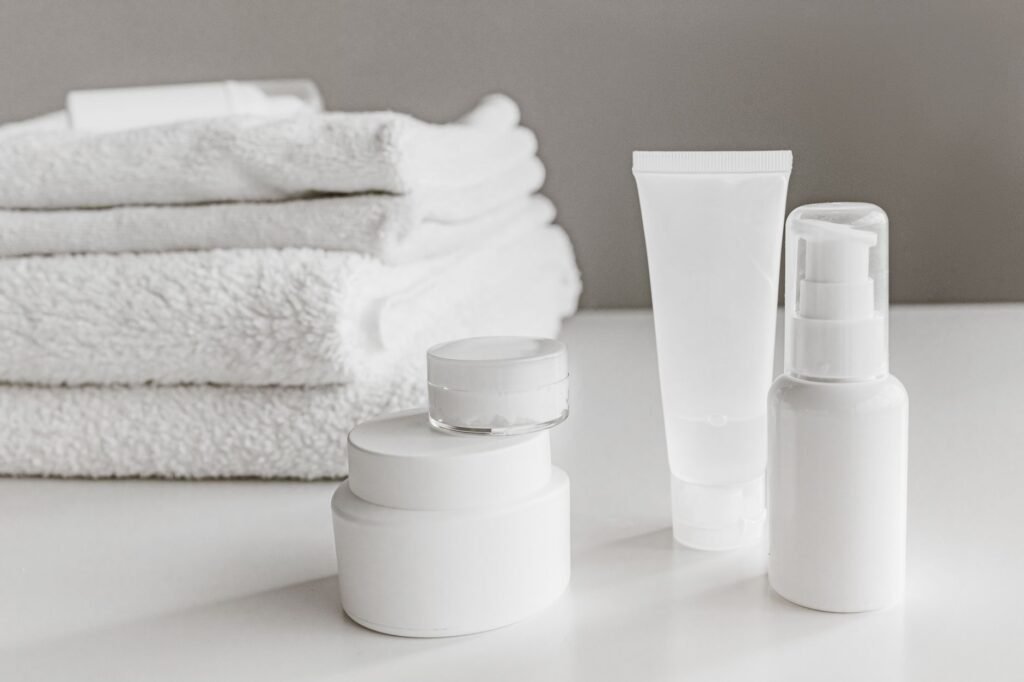 CeraVe price in Pakistan – Minimalist arrangement of white skincare products and towels for a modern aesthetic.