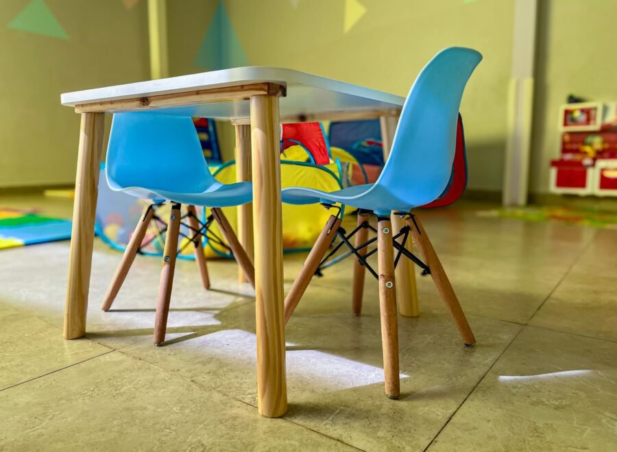 baby study table chair set price in pakistan – Colorful and inviting kiddie area with modern chairs and a sturdy table in a vibrant playroom.
