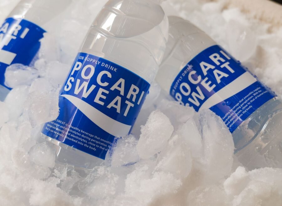 electrolyte supplements for summer Pakistan – Chilled Pocari Sweat bottles resting in ice, showcasing hydration and refreshment.