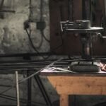 makita drill machine price in pakistan – A detailed view of a metalwork workshop showcasing tools, machinery, and steel bars.