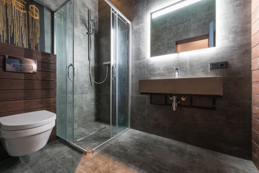 shower panel price in pakistan – Sleek modern bathroom featuring a glass shower and elegant fixtures.