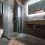 shower panel price in pakistan – Sleek modern bathroom featuring a glass shower and elegant fixtures.
