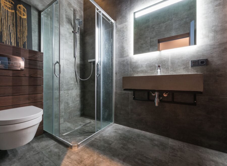 shower panel price in pakistan – Sleek modern bathroom featuring a glass shower and elegant fixtures.