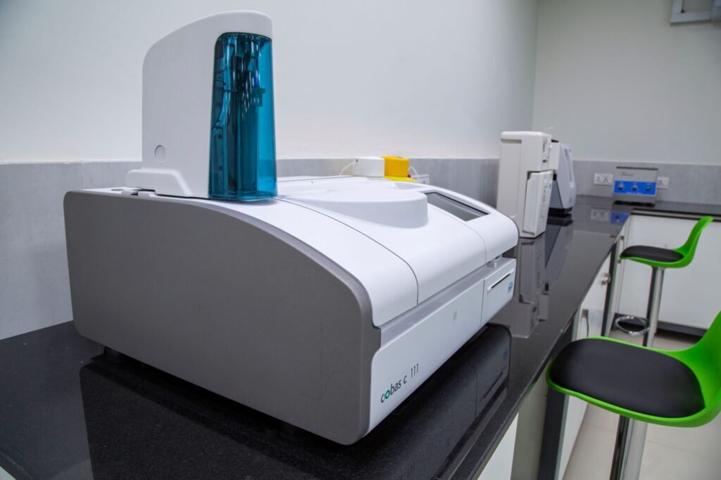 spectrophotometer price in pakistan – Sleek, modern laboratory equipment on a black countertop in a professional lab setting.