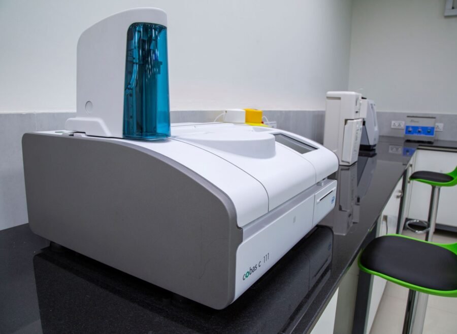 spectrophotometer price in pakistan – Sleek, modern laboratory equipment on a black countertop in a professional lab setting.